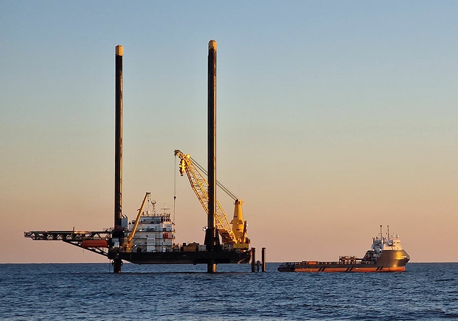 Liftboat and supply vessel setting up for an offshore wind farm